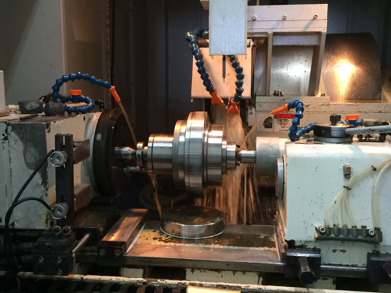Grinding is a process of removing material from a surface using abrasive materials. It is commonly used in manufacturing and metalworking industries to produce smooth and precise finish on metal parts.
